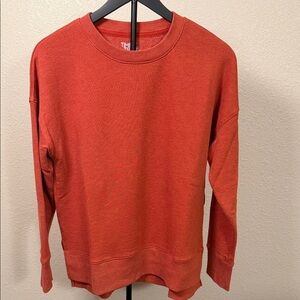 Women’s orange sweatshirt